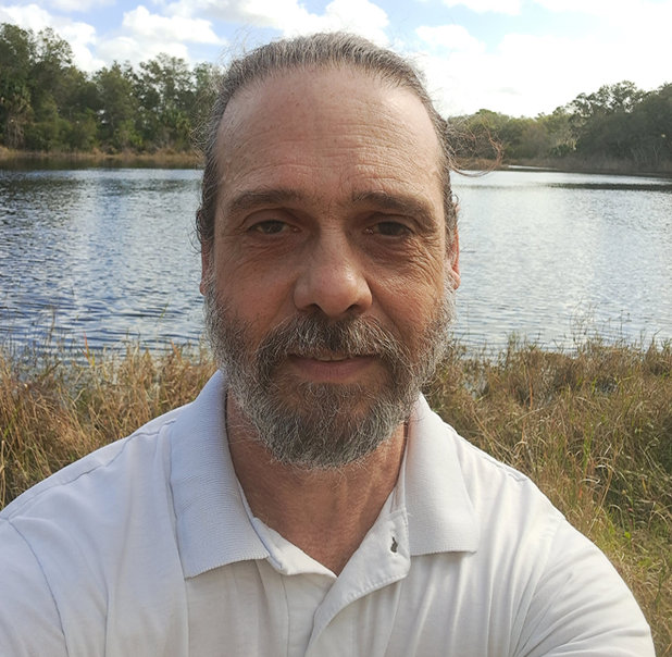 Lawrence Damasio beside a lake